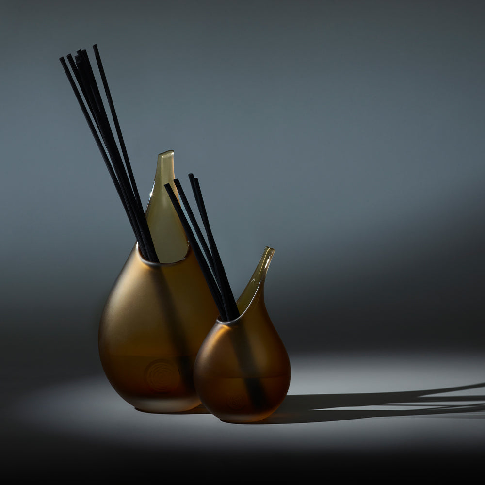 Image of the Senti duo reed diffusers on a dark background